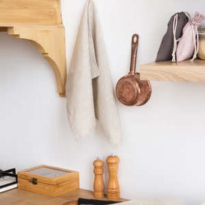 Beautiful organic linen towel made from 100% natural flax — soft, durable, and eco-friendly. Perfect as a kitchen or bath tea towel, this high-quality handmade linen sheet brings a warm natural texture to any home. Ideal sustainable gift for Thanksgiving dinner, Christmas morning, New Year’s Eve celebration, or Valentine’s Day. Elegant and timeless design by CoolLinen — modern organic home décor brand focused on quality, simplicity, and sustainability.