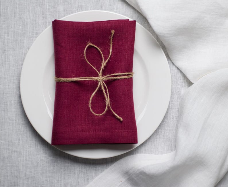 Plum organic linen napkins in a rich deep shade, perfect for elegant table styling, romantic dinners, autumn entertaining and luxury home decor. Soft washed reusable linen fabric with natural texture and refined mitered corners, designed for weddings, farmhouse dining, cottagecore interiors and modern minimalist tablescapes. Handmade eco friendly dinner napkins in a timeless plum color that adds warmth, depth and sophistication to everyday dining, holiday gatherings, sustainable table settings