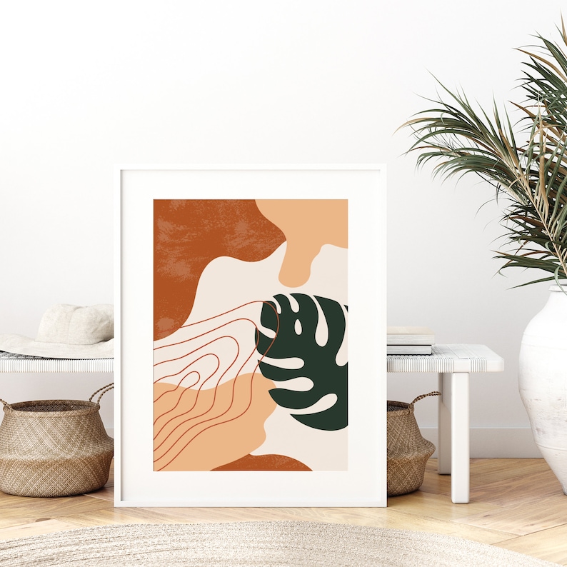 May include: Abstract art print with a green leaf, orange, brown, and peach shapes, and a white background.