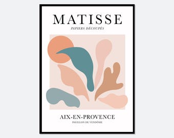 Op de afbeelding: Een ingelijste kunstdruk met de tekst MATISSE PAPIERS DÉCOUPÉS bovenaan en AIX-EN-PROVENCE PAVILLON DE VENDÔME onderaan. De centrale afbeelding toont abstracte organische vormen in gedempte tinten perzik, blauwgroen en lichtbruin.