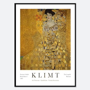 May include: A framed art print featuring Gustav Klimt's Portrait of Adele Bloch-Bauer I. The image displays a woman in a gold-toned, patterned dress against a shimmering gold background. Text at the bottom reads KLIMT, Portrait of Adele Bloch-Bauer I, 1907, The Leopold Museum, Art Nouveau, Symbolism, Vienna Secession.