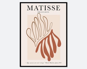 Op de afbeelding: Een ingelijste kunstdruk met de tekst MATISSE THE CUT-OUTS bovenaan en My curves are not crazy. Henri Matisse, Jazz, 1947 onderaan. Het midden toont een abstracte organische vorm in terracotta en witte lijnkunst op een beige achtergrond.