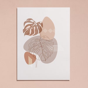 May include: Abstract art print featuring a brown and beige color scheme with a stylized leaf design. The print features a large leaf with a geometric pattern and two smaller leaves with a more organic shape.