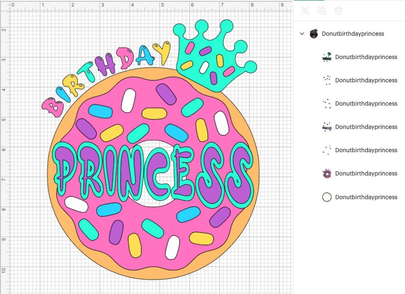 May include: A pink donut with colorful sprinkles and the words "Birthday Princess" in a colorful font. A blue crown with white and pink sprinkles is on top of the donut.