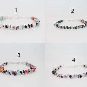 May include: Four bracelets made with small, colorful gemstone chips. Each bracelet has a different color scheme, including white, purple, green, and orange.