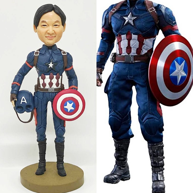 May include: A custom bobblehead figurine of a person dressed as Captain America. The figurine is holding a miniature Captain America shield and helmet. The figurine is standing on a brown base. The image also shows a full-body view of a Captain America action figure.