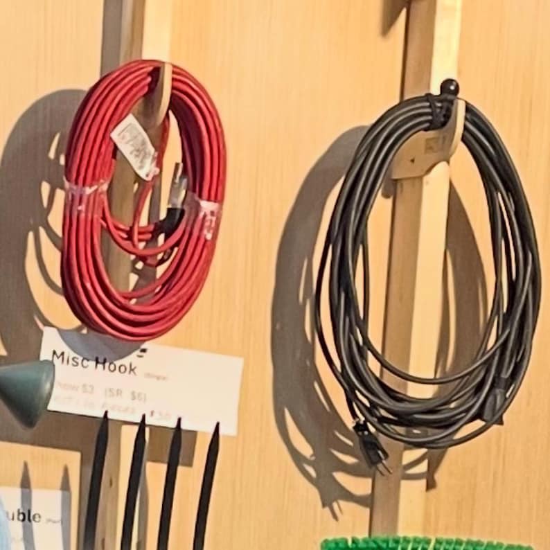 Our durable Misc organizer hook store extension cords, trimmers,chainsaws and the variety of items you store in your yard shed. Works perfect as a yard tool hook.  Simple to install and looks great.