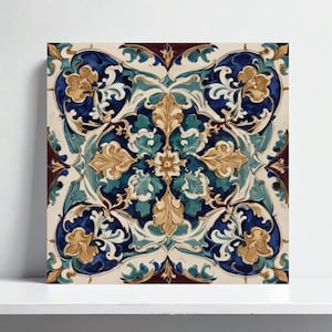 May include: Square ceramic tile with a detailed floral pattern in shades of blue, teal, gold, and cream. The design features stylized leaves and flowers arranged symmetrically, with a dark burgundy border.