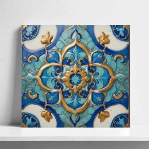 May include: Square ceramic tile with a detailed, ornate design. The tile features a central floral motif in gold, surrounded by blue and turquoise patterns. The design is set against a white background, creating a striking contrast. The tile is likely for decorative use.