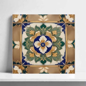 May include: Square ceramic tile with a floral design. The central flower is white and blue, surrounded by green leaves and gold accents. The border is a warm brown with cream-colored floral corner accents.