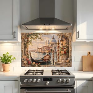 May include: A decorative kitchen backsplash mural composed of multiple square tiles featuring a detailed painting of a Venetian canal scene with a gondola, ornate stone archways, blooming flowers, and historic architecture under a soft sky.