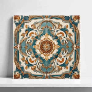 May include: Square decorative tile with a detailed floral pattern. The design features a central medallion in shades of brown and gold, surrounded by teal and orange scrollwork on a cream background. The tile is displayed on a white shelf.