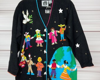 NWT Woman es Storybook Strick Cardigan Pullover "Hold Hands For Peace" Kinder auf der ganzen Welt Schwarz Baumwolle Blend Bestickt Größe L