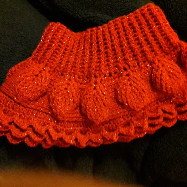 Lady's red cowl, with leaf design.