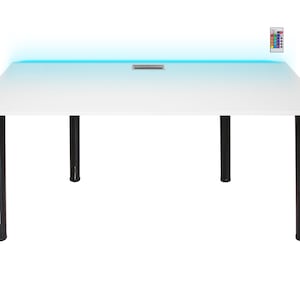 May include: White rectangular desk with black legs and a blue LED light strip along the front edge. The desk has a small rectangular cutout in the centre of the surface.