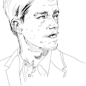 May include: A black and white ink drawing of a person's face in profile. The person has short hair, a goatee, and is wearing a collared shirt and a blazer. The drawing style is detailed, with visible lines and shading.