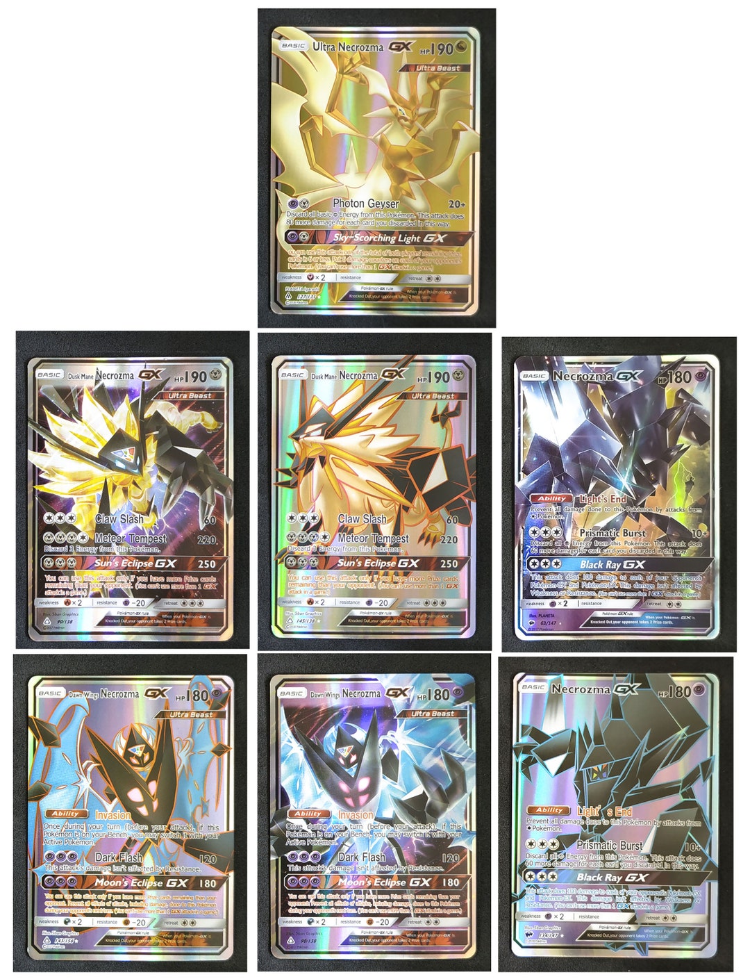 Pokémon Cards: Solgaleo GX (Gold) - Dusk Mane Necrozma GX (Black) - Slugma