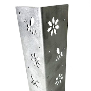 May include: A silver metal corner post with a decorative design of bees and flowers cut out. The post is made of metal and has a smooth, shiny finish.