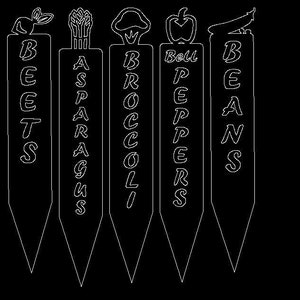 May include: Five white plant markers with black lettering. The markers are labeled "Beets", "Asparagus", "Broccoli", "Bell Peppers", and "Beans".