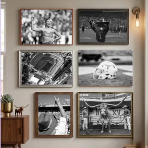 May include: A gallery wall featuring six black and white framed prints depicting University of Texas sports themes, including a cheerleader, a mascot, an aerial stadium view, a football helmet, a fan in a hat, and a longhorn steer with handlers.