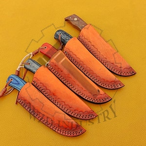 May include: Five leather sheaths with knives inside. The sheaths are brown with decorative stitching and the knives have wooden handles.