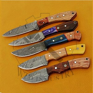 May include: Five Damascus steel knives with different colored wooden handles. The handles are made of wood with different colors and patterns. The blades are all Damascus steel with a wavy pattern.
