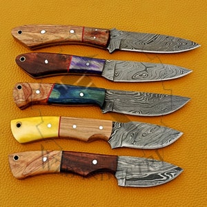 May include: Five different knives with wooden handles and Damascus steel blades. The handles are made of different types of wood, including walnut, maple, and rosewood. The blades are all very sharp and have a beautiful Damascus pattern.