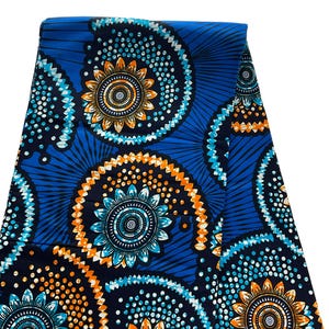 May include: Blue and black fabric with a repeating pattern of orange and white stylized flowers with a blue and white center. The fabric has a dotted pattern.