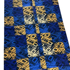 May include: A rectangular fabric piece featuring a repeating checkered pattern of deep blue and metallic gold squares. Each square contains a textured, abstract design of overlapping lines and geometric shapes in contrasting blue and gold tones.