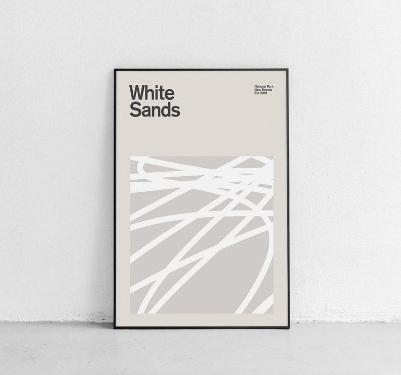 May include: A black framed poster with the text "White Sands" and "National Park, New Mexico, Est. 1933" in white text. The poster features an abstract design of white lines on a light gray background.