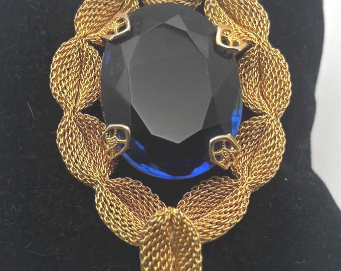 Gold Tone Mesh Brooch with Large Blue Crystal Stone