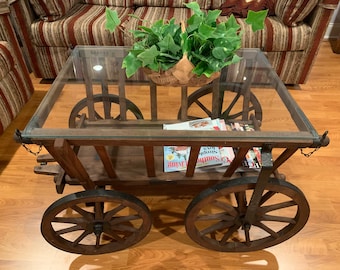 Antique Wheeled Wood Coffee Table with Glass Top