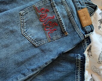 flame embroidered jeans