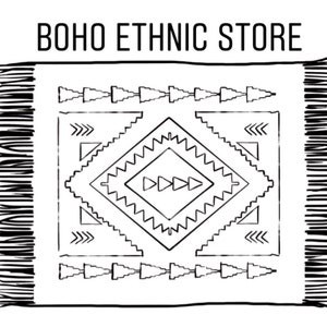May include: Black and white illustration of a rug with a geometric pattern. The rug has fringe on the edges and the text "BOHO ETHNIC STORE" is at the top of the image.