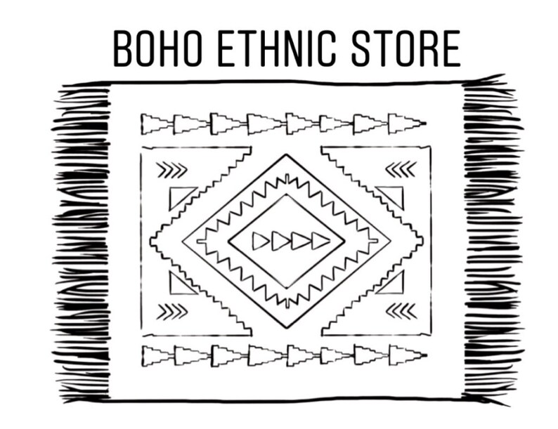 May include: Black and white illustration of a rug with a geometric pattern. The rug has fringe on the edges and the text "BOHO ETHNIC STORE" is at the top of the image.