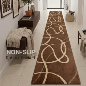 May include: A long rectangular runner rug featuring a dark brown base color with a repeating pattern of light beige swirling, intersecting circular lines. The rug includes a non-slip rubber backing for stability on smooth floor surfaces.