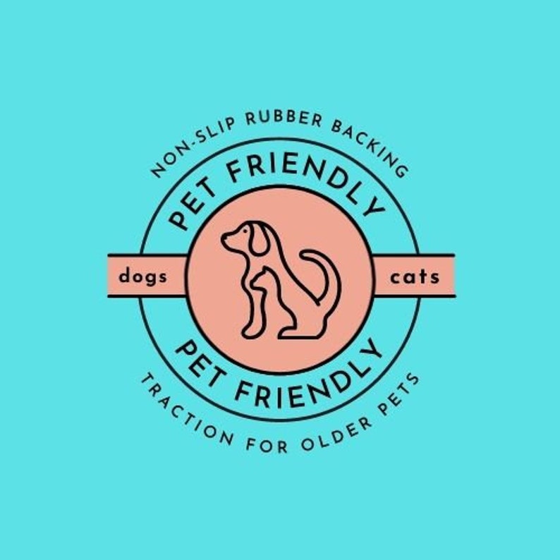 May include: A pink and blue circular logo with the text "PET FRIENDLY" in a black circle. The logo also includes the text "NON-SLIP RUBBER BACKING" and "TRACTION FOR OLDER PETS". The logo features a line drawing of a dog and cat.