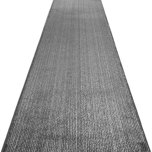 May include: A gray runner rug with a textured, ribbed surface. The rug is designed to be placed in a hallway or entryway.