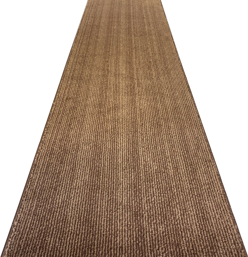 May include: A brown and beige striped runner rug with a textured surface.