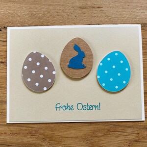 Osterkarte creme beige türkis farbige Ostereier und Osterhase Gruß Frohe Ostern Karte