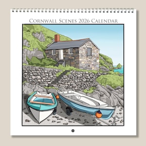 May include: A 2026 calendar with a coastal illustration. It shows a stone cottage, two boats, and the text "Cornwall Scenes 2026 Calendar." The boats are teal and light blue. The cottage has a grey roof and a red chimney. The background features green hills and a blue sea.