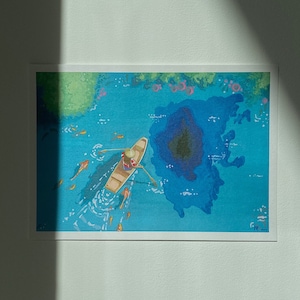 May include: A watercolor painting of a person rowing a boat on a blue lake with a dark blue island in the center. The lake is surrounded by green trees and there are small orange fish swimming around the boat.
