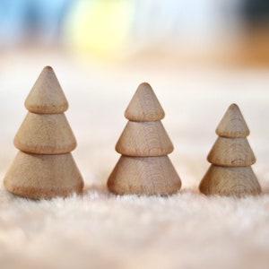 3 wooden fir trees