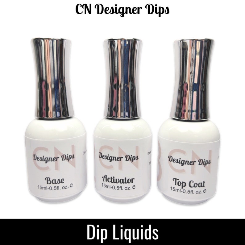 May include: Three bottles of nail dip liquids labeled "CN Designer Dips" with the words "Base", "Activator", and "Top Coat" on each bottle. Each bottle contains 0.5 fl. oz. of liquid.