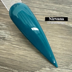 May include: A teal blue nail dip powder bottle with the text "Nirvana CN Designer Dips" on the label.