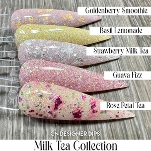 May include: Six different shades of pink nail dip powder, each with a different glitter or shimmer finish. The shades are labelled "Goldenberry Smoothie", "Basil Lemonade", "Strawberry Milk Tea", "Guava Fizz", "Rose Petal Tea", and "Milk Tea Collection".