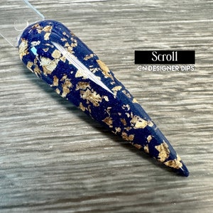 May include: A dark blue nail dip with gold flakes, labelled "Scroll" and "CN Designer Dips".