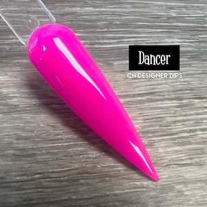 May include: A bright pink nail dip powder called "Dancer" by CN Designer Dips.