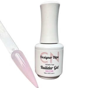 May include: A clear bottle of pink builder gel nail polish with a white cap. The bottle label reads "Designer Dips HEMA Free Builder Gel Pink 15ml - 0.5 fl. oz."