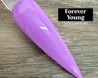 May include: A close-up of a purple nail polish bottle with a silver cap. The bottle is labeled "Forever Young" and "CN Designer Dips".